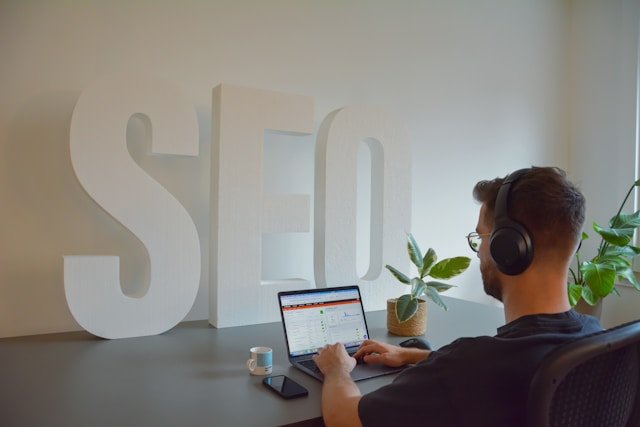 Professional providing SEO services on a laptop
